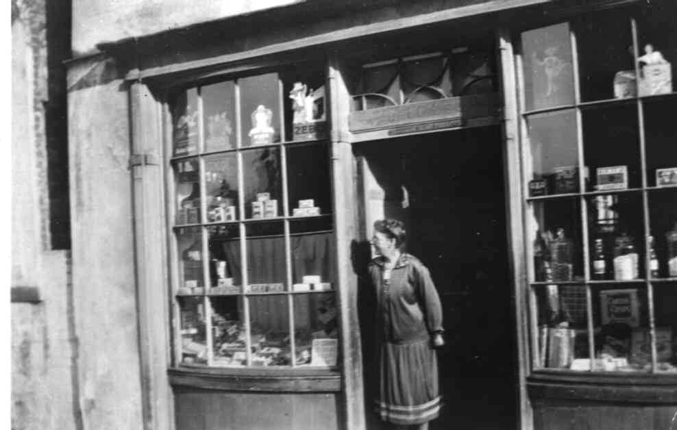 Anstice Le POIDEVIN pictured standing in the Doorway of The Shop in Cornet Street c1948. Anstice, a Spinster tookover the running of the Shop from her father.